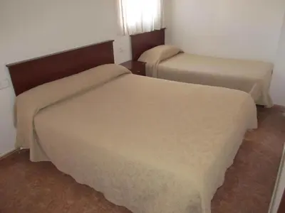 Cama o camas de una habitación en Hostal Las Torres