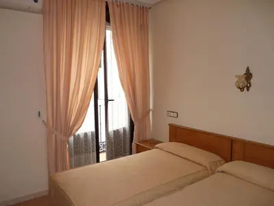 Cama o camas de una habitación en Hostal Fernandez