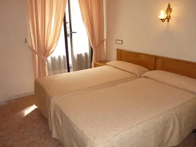 Cama o camas de una habitación en Hostal Fernandez