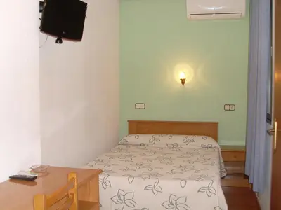 Cama o camas de una habitación en Hostal Fernandez