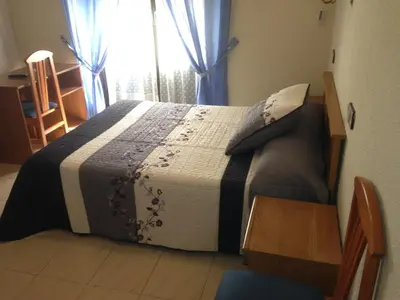 Cama o camas de una habitación en Hostal Fernandez