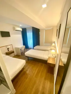 Cama o camas de una habitación en Far Home Gran Vía