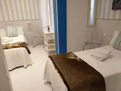 Cama o camas de una habitación en Hostal Mendoza