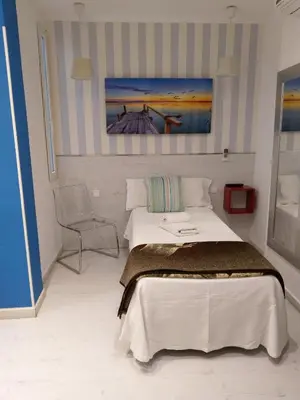 Cama o camas de una habitación en Hostal Mendoza
