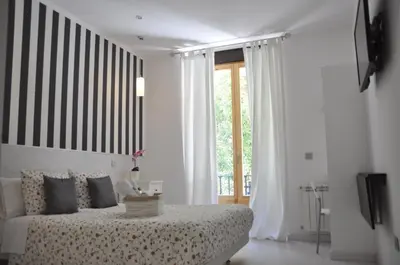 Cama o camas de una habitación en Hostal Mendoza