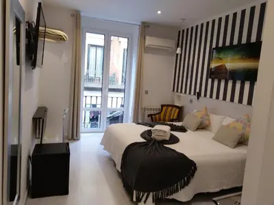 Cama o camas de una habitación en Hostal Mendoza