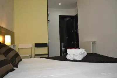 Cama o camas de una habitación en Hostal El Brezo