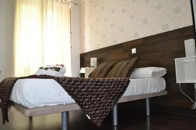 Cama o camas de una habitación en Hostal El Brezo