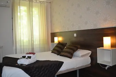 Cama o camas de una habitación en Hostal El Brezo