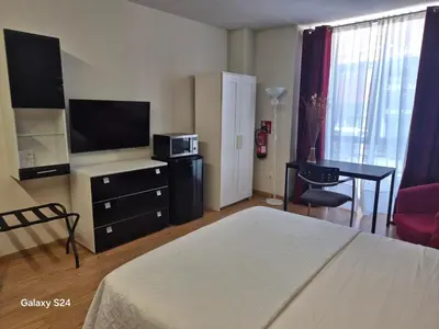 Una televisión o centro de entretenimiento en APARTAMENTOS SANTA JULIANA