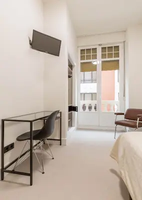 Una televisión o centro de entretenimiento en Hostal Excelsior