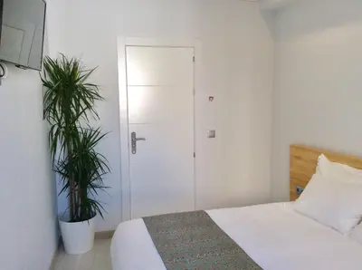 Cama o camas de una habitación en Hostal Palacio Luna