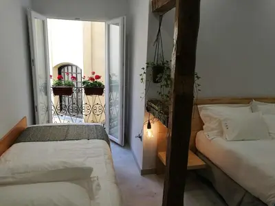 Cama o camas de una habitación en Hostal Palacio Luna