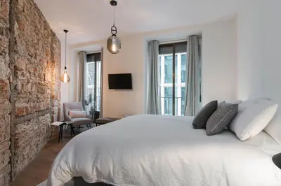 Cama o camas de una habitación en Preciados Gran Via Luxury Callao