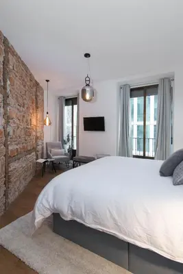 Cama o camas de una habitación en Preciados Gran Via Luxury Callao
