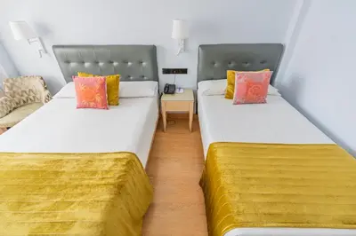 Cama o camas de una habitación en Hotel Sancho