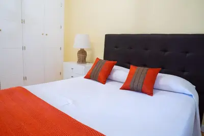 Cama o camas de una habitación en Apartamentos Duque Ventas