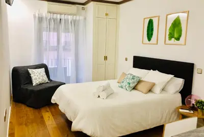 Cama o camas de una habitación en CHUECA Apartamentos Noxi