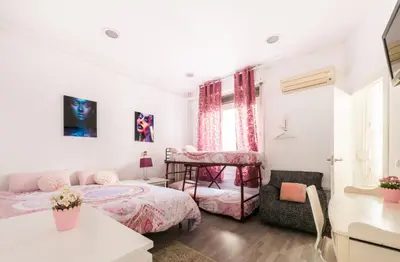 Cama o camas de una habitación en M&F 7 ROOMS/7 BATHROOMS OVER GRAN VIA