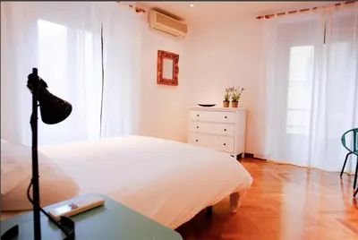 Cama o camas de una habitación en GRAN VÍA CHUECA Apartamentos Noxi