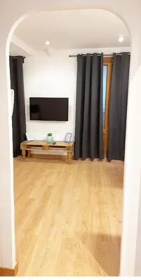 Una televisión o centro de entretenimiento en GRAN VÍA CHUECA Apartamentos Noxi