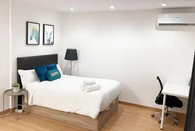 Cama o camas de una habitación en GRAN VÍA CHUECA Apartamentos Noxi