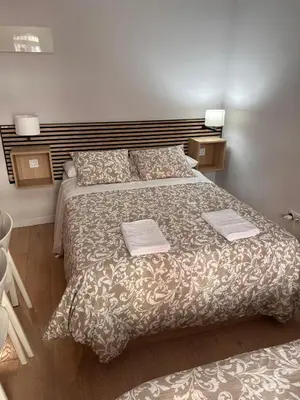 Cama o camas de una habitación en Room Gran Vía Apartments