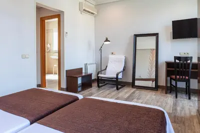 Cama o camas de una habitación en Hotel Mediodia