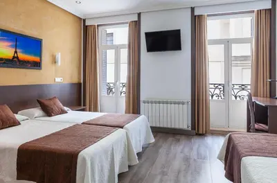 Cama o camas de una habitación en Hotel Mediodia