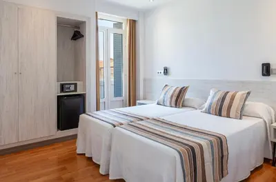 Cama o camas de una habitación en Hotel Mediodia