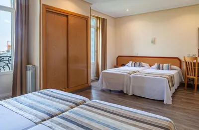 Cama o camas de una habitación en Hotel Mediodia