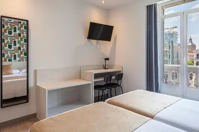 Cama o camas de una habitación en Hotel Mediodia