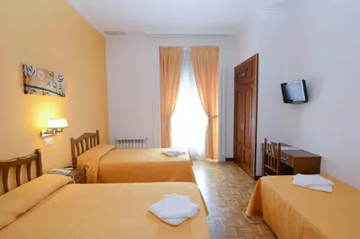 Cama o camas de una habitación en Hostal Edreira