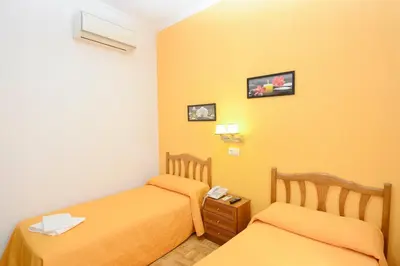 Cama o camas de una habitación en Hostal Edreira