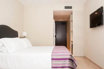Cama o camas de una habitación en Exe Moncloa