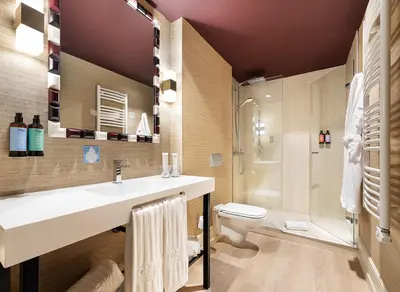 Un baño de One Shot Luchana