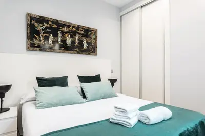 Cama o camas de una habitación en Waou Los Austrias I - Alquiler Corta Duración