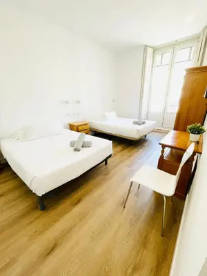 Cama o camas de una habitación en Hostal Ruano