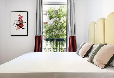 Cama o camas de una habitación en Smartr Atocha Reina Sofia