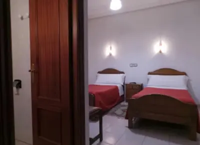 Cama o camas de una habitación en Hostal Gaudí