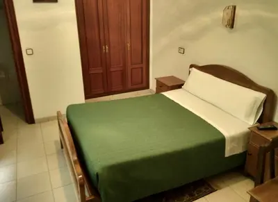 Cama o camas de una habitación en Hostal Gaudí