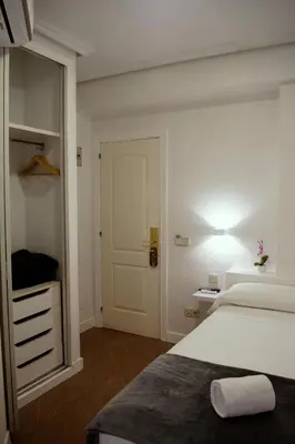 Cama o camas de una habitación en Hostal Ártico