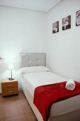 Cama o camas de una habitación en Hostal Ártico