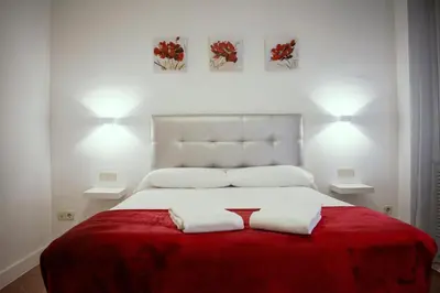 Cama o camas de una habitación en Hostal Ártico