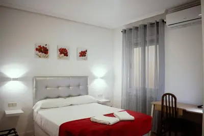 Cama o camas de una habitación en Hostal Ártico