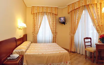 Cama o camas de una habitación en Hostal Silserranos