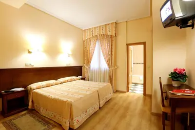 Cama o camas de una habitación en Hostal Silserranos
