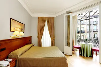 Cama o camas de una habitación en Hostal Macarena