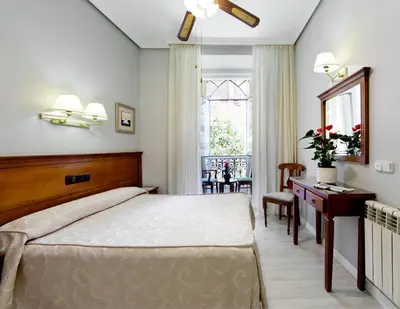 Cama o camas de una habitación en Hostal Macarena