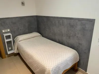 Cama o camas de una habitación en Hostal Retiro